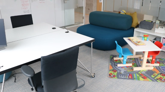 Photo of an office workspace with child play area