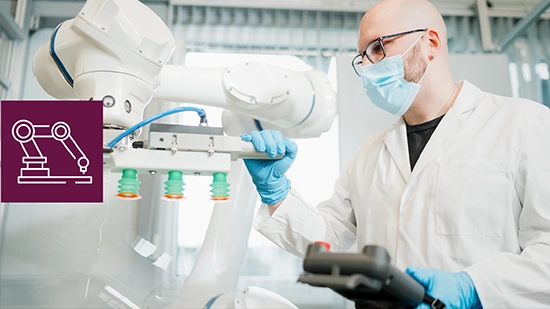 Laboratory personnel operating an automated robotic system in a laboratory environment. An icon on the image represents industrial automation and robotics.