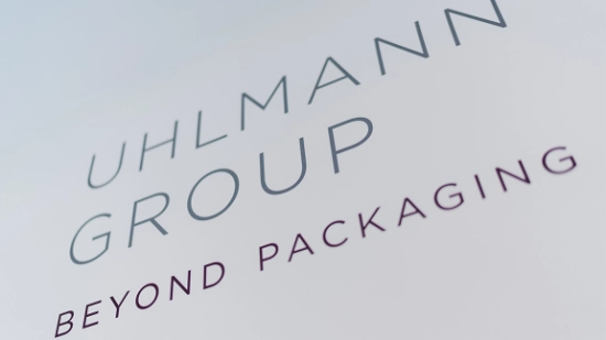 Uhlmann Group logo with claim "beyond packaging"