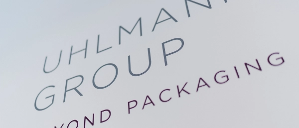 Uhlmann Group logo with claim "beyond packaging"